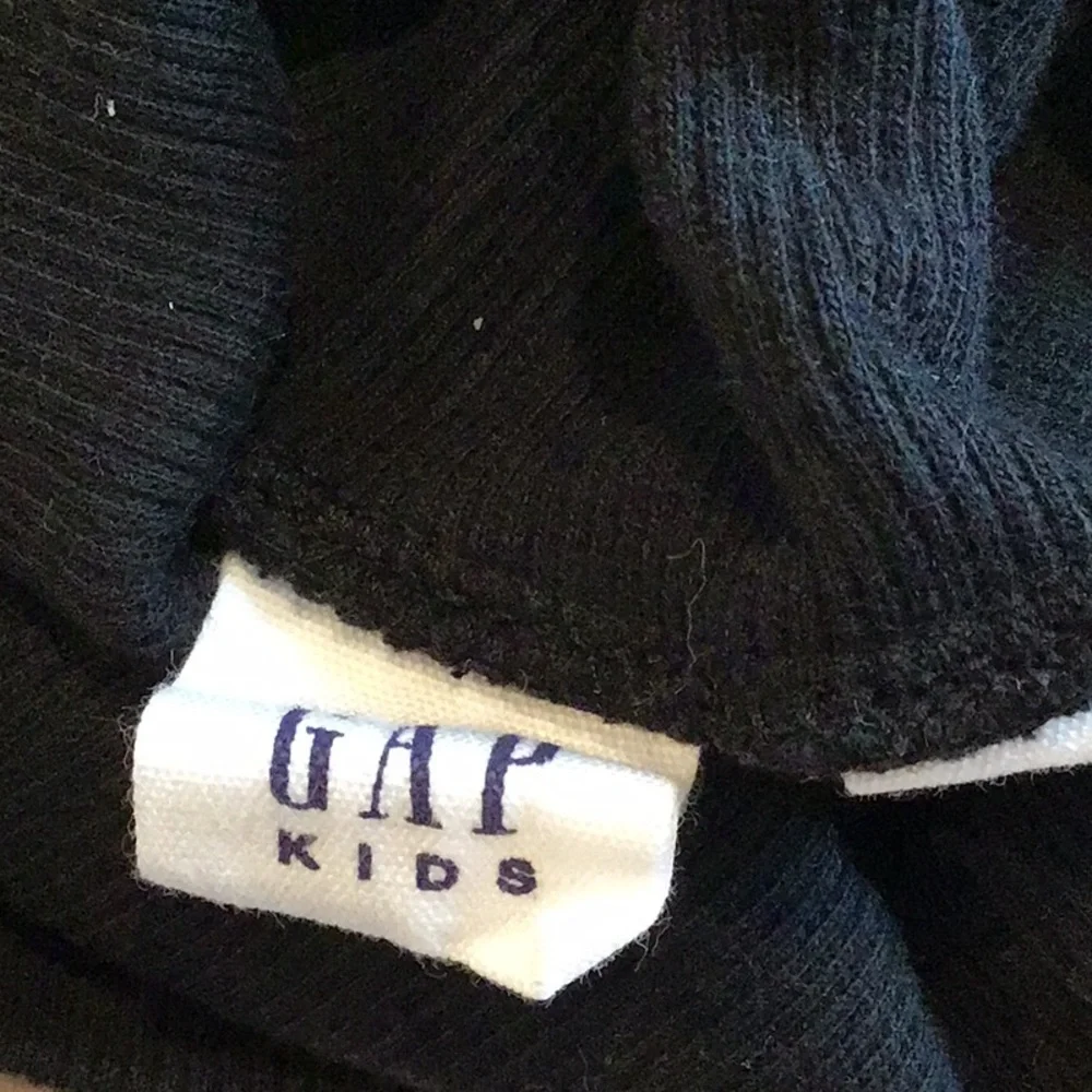 GAP - a long-sleeved, ribbed knit top notable for its puff shoulders.